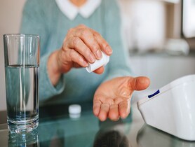 photo of a woman taking medication