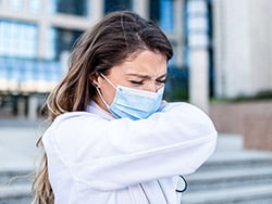 photo of a doctor sneezing