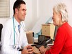 photo of older woman talking to doctor