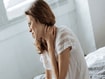 photo of Sad depressed woman suffering from neck i