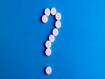 photo of question mark with pills