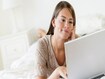 photo of Girl Using Laptop In Bed