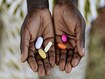 photo of African Girl Holding Pills