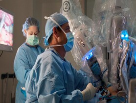 photo of Surgeon performing robotic surgery