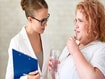photo of an obese patient speaking to a doctor