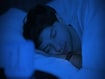 photo of a man wearing a sleep tracker