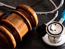 photo of a gavel and stethoscope.