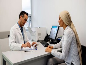 photo of Oncologist talking to a female patient