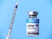 photo of Cancer mRNA vaccine vial and syringe.