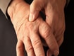 photo of Joint pain on hand of older man