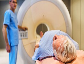 photo of Senior man receiving MRI