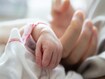 photo of New born baby hand hold