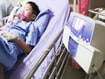 photo of  boy with inhaler hospital bed