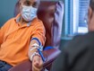 photo of senior man donating blood