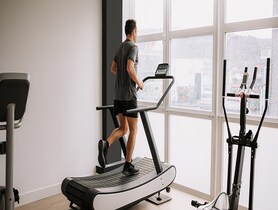 photo of man running on a treadmill