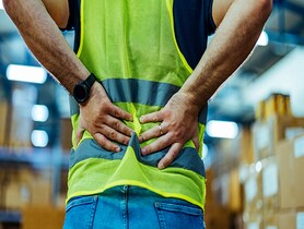 photo of worker with backpain