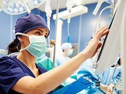 photo of Nurse working with technology in operating room