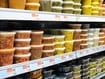 photo of Plastic containers of food on supermarket shelves