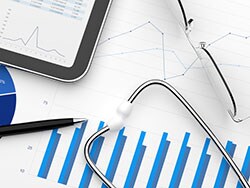 photo of Healthcare finance account report tablet pc stethoscope