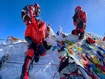 photo of mountaineers at the summit of Mount Everest
