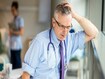 photo of exhausted doctor