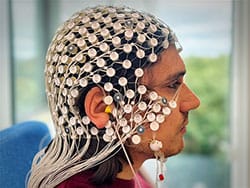 photo of LDAEP headset with 256 electrodes delivering 60–100 dB tones.