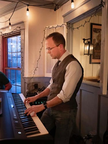 photo of Rob DeMuro sometimes takes on another project, performing at the Deer's Head with his band.
