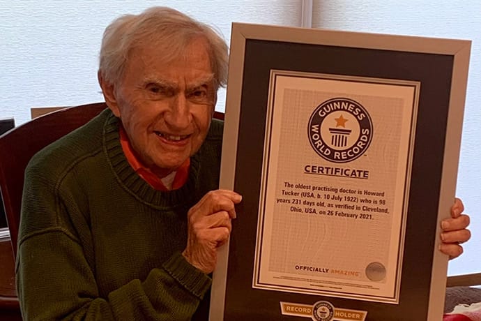 photo of Tucker shows off his Guiness World Records certificate