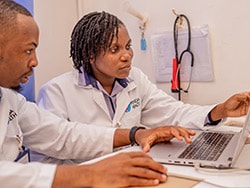 photo of Penda Health clinicians Oscar Murebu and Naomi Ndwiga review informatio