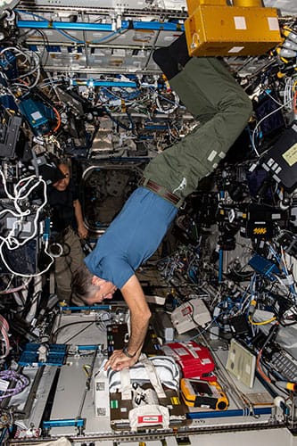 photo of NASA Expedition 70 Commander Andreas Mogensen of the European Space Agency stabilizes himself in microgravity. 
