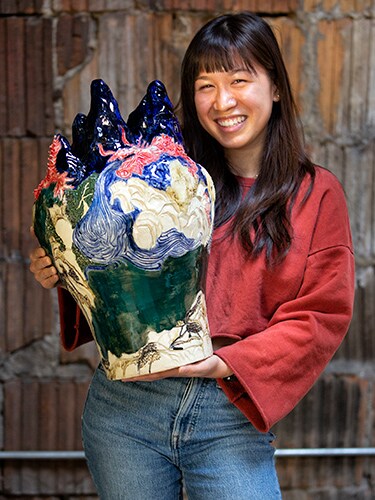 photo of Rebecca Ho shows a finished ceramic piece.