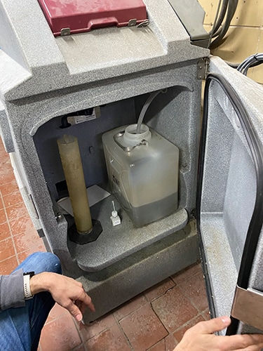 photo of A sample of untreated water is collected from this temperature-controlled unit each day.