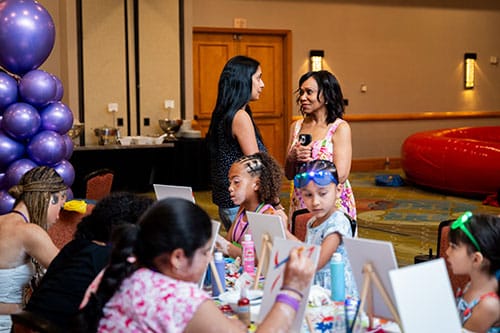 photo of Dr. Pearl Grimes with more of the campers in 2024, Camp Victory's first year.