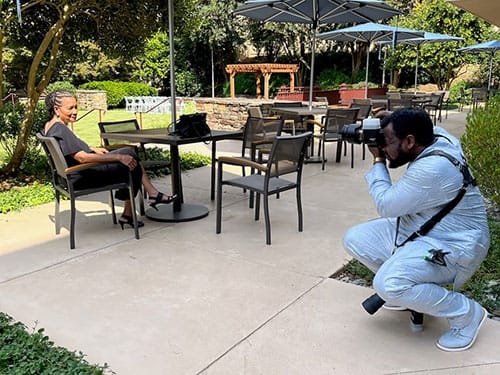 photo of Omotola Ajibade photographing one of his clients