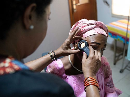 photo of A patient being examined for the effects of skin bleaching products.