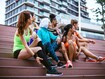 THUMBNAIL, Multi ethnic group of young women exercise outdoor, next to the river. They are wearing sport clothing, running, stretching, celebrate and support each other.
