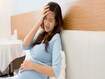 photo of Asian pregnant woman with headache