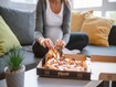 photo of pregnant woman eating pizza