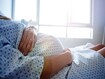 photo of pregnant woman's belly in the hospital 