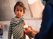 photo of a child being measured for malnutrition